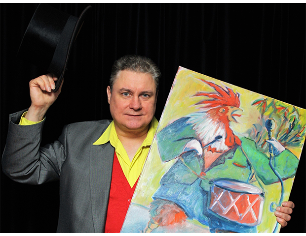 Intendant Günter Rüdiger. Das Kunstwerk in seiner Hand hat der Berliner Maler Peter Schönfeld, bekannt als PESCH, für das Zimmertheater gemalt. (Foto: Promotion Zimmertheater Steglitz)